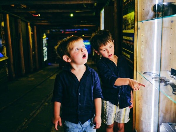 Young Children looking through Replica Underground Coal Mine